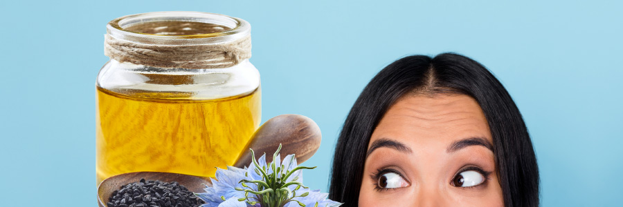 Image of a person looking at black seed oil