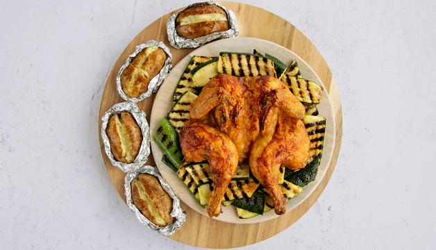 BBQ Spatchcock Chicken with Baked Potatoes and Grilled Zucchini